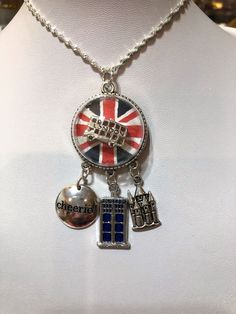 Lovely silver plated London bus on a background of the English Union Jack Flag with three charms, a castle, Cheerio and blue police call box. Glass globe is 30 mm, about 1 inch. Charms add another 1-1 1/2 inches.  Comes with a 22" silver plated chain. NO TWO ALIKE! EACH IS UNIQUE. There may be some glare in the photos on the glass globe. There is no tarnish and all pieces are polished prior to shipping. Have a theme in mind?  I take requests for specialized or personalized ideas... Let me know! Police Call, Jack Flag, Union Jack Flag, London Bus, A Castle, Union Jack, Glass Globe, Dr Who, The English