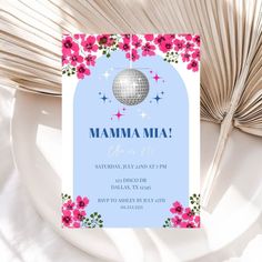 a blue and pink birthday party card with flowers on the front, and a disco ball in the middle