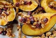 baked acorns with nuts and cranberries on a plate