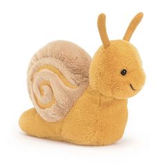 a small yellow stuffed snail on a white background