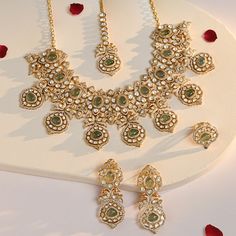 Introducing our exquisite oversized Kundan necklace set with captivating emerald stones, complete with matching earrings and maangtikka perfect for a stunning wedding look. Shop Now: https://dyulokha.com/products/regal-emerald-kundan-bridal-set #Dyulokha #jewellery #jewellerylove #jewellerylover #jewels #jewelsofinstagram #bridaljewelry #BridalBliss #weddingbeauty Kundan Bridal Set, Kundan Necklace Set, Artificial Jewelry, Maang Tikka, Kundan Necklace, Wedding Look, Jewelry Indian, Emerald Color, Kundan Necklaces