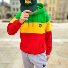 This classic thick and fleshy hoodie made from high-quality brushed fabric, consisting of: 90% cotton, 10% polyester. The hoodie features a tricolor block pattern in Rasta / Reggae colors, creating a unique and original style. The hood has metal eyelets at the drawstring, and a embroidered Lion of Judah applique on the left chest. The side seam label is designed in Rastafari style. This product is made of the highest quality cotton yarn, and certified by Oeko Tex Standard 100 and the Internation Multicolor Fleece Sweatshirt With Drawstring Hood, Sporty Cotton Sweatshirt With Color Matching, Urban Multicolor Hooded Hoodie, Sporty Color Block Hoodie, Casual Cotton Hoodie With Color Matching, Cotton Hooded Sweatshirt With Color Matching, Sporty Cotton Color Block Hoodie, Cotton Color Block Hoodie Sweatshirt, Long Sleeve Fleece Hoodie With Contrast Color