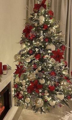 a christmas tree decorated with red and silver ornaments