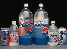 several pepsi bottles are lined up on a table