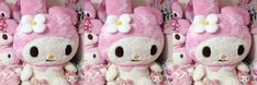 hello kitty stuffed animals are lined up in pink and white colors with bows on their heads