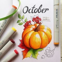 an autumn coloring book with crayons and markers