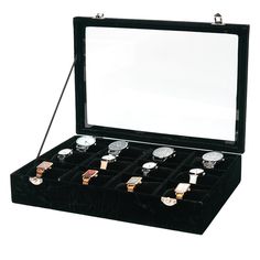 an open watch box with twelve watches in it's display case on a white background