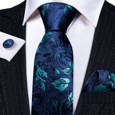 Elevate your formal wear look with our Navy Blue Teal Floral Silk Tie Pocket Square Cufflink Set. The high-quality silk fabric is perfect for weddings and other special occasions, and the navy blue and teal floral pattern is sure to turn heads. The set includes a tie, pocket square, and cufflinks, making it a convenient and stylish choice for any formal event. 100% Silk Handmade Package Includes: Tie, Pocket Square & Cufflinks. Length: 59" Width: 3.34" Warm iron if needed Cyan Blue, Cufflink Set, Cufflinks Wedding, Wedding Business, Floral Jacquard, Silk Necktie, Blue Paisley, Navy Blue Color, Blue Teal