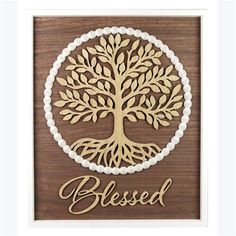 a wooden plaque with the words, blessing and a tree