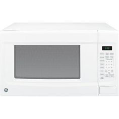 a white microwave oven with the door open