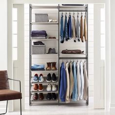 an organized closet with clothes and shoes on shelves, hanging from the ceiling in front of a chair