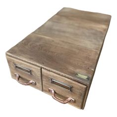 an old wooden desk with two drawers and metal handles on the top, against a white background