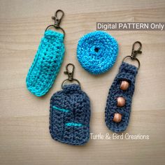 three crocheted keychains are sitting on a table next to each other