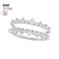 a white gold ring with three rows of diamonds on the front and back of it