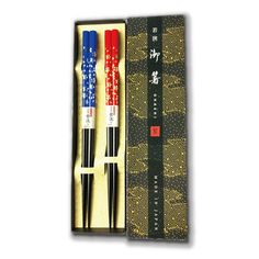 two red and blue chopsticks in a box