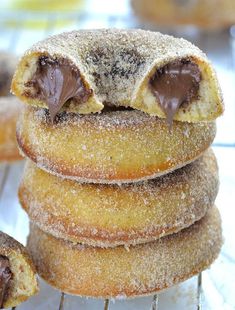 chocolate covered doughnuts stacked on top of each other