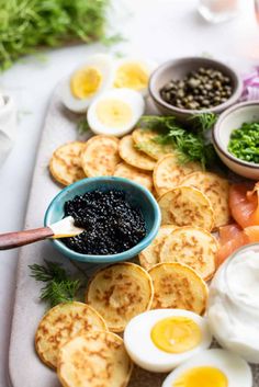 an assortment of food is displayed on a platter, including eggs and other ingredients