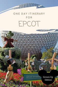 the epcot sign in front of spaceship shaped building with flowers and plants around it