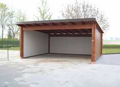 an empty carport in the middle of a parking lot