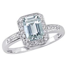 Express your love with this elegant Aquamarine and Diamond Halo Cocktail Ring. Crafted in lustrous white gold, this ring features an emerald-cut 7x5 mm aquamarine gemstone, and 14 round-cut, pave-set diamond accents shimmer along with the band.  Product Features:  * Set in 10k white gold * 1 ct. t.g.w. aquamarine * 0.06 ct. t.w. diamond * Diamond quality: G-H/I2-I3 * Includes 1-pc. halo ring in 10k white gold  (Model BJ0001296-4) Product information is provided by the supplier and BJ’s does not represent or warrant the information is accurate or complete. Always consult the product’s labels, warnings, and instructions before use. Please see additional terms atbjs.com/termsofuse Vintage Halo Ring, Vintage Halo, Evening Outfit, Diamond Fashion Rings, Black Diamond Ring, Gold Halo, Aquamarine Rings, White Gold Engagement