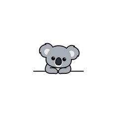 a koala bear sitting on top of a white surface