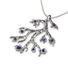 This unique branch-shaped pendant with Sapphires is a perfect addition to our extensive collection of organic rings and earrings.All our jewelry, personally designed by Arosha, are available exclusively at our online shops. They are original creations handmade per order with skillful goldsmithing work, comfortable to wear due to their ergonomic shapes and carefully finished with the passion for quality that is our mark.CHAINYou can add a Sterling Silver chain to your pendant.We offer 3 lengths o Hand Cast Nature-inspired Sterling Silver Jewelry, Hand Cast Freeform Jewelry For Gifts, Sterling Silver Tree Of Life Nature-inspired Jewelry, Nature-inspired Freeform Silver Jewelry, Nature-inspired Hand Cast Pendant Jewelry, Nature-inspired Hand-cast Pendant Jewelry, Blue Hand Cast Jewelry Gift, Unique Hand Cast Blue Jewelry, Twig Jewelry