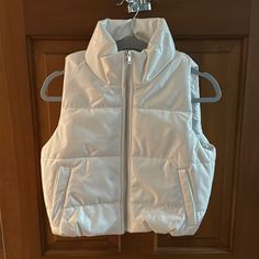 Shiny Faux Leather. Super Cute. Size Small Is Nwt. Size Large Has Been Worn Once. Excellent Condition. Silver Hardware. Pockets. Girls Puffer Vest, Puffy Vest, Vest Pattern, Faux Fur Vests, Girl Coat, Puffer Vest, Kids Jacket, Christmas List, Silver Hardware