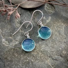 "Medium Size Blue Raindrop Earrings, Boho Silver Aesthetic Earrings, Simple Hippie Earrings, Light Blue Minimalist Nature Lover Gift, Best Friend Gift This collection is inspired by the beauty of rain and the rainbow of colors seen in nature. This is the perfect gift for anyone that loves nature, simplicity, and a customizable look! The sparkle is subtle and simple and changes depending on the lighting and the colors behind the glass. This wanderlust, boho, hippie style earrings are the perfect Nickel Free Glass Jewelry In Minimalist Style, Minimalist Glass Dangle Jewelry, Minimalist Nickel-free Glass Jewelry, Minimalist Glass Drop Earrings, Minimalist Glass Earrings For Gift, Everyday Round Glass Jewelry, Minimalist Glass Dangle Earrings, Everyday Glass Drop Earrings, Hypoallergenic Round Glass Earrings