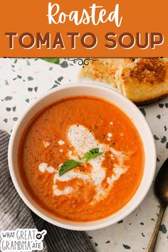 a bowl of roasted tomato soup with bread on the side and text overlay that reads roasted tomato soup