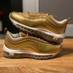 Nike Air Max 97 Lx Color: Metallic Gold/White Style Code: Cj0625-700 Women's Size 6 Condition Is New With Box, However The Box Is Missing The Lid. 100% Authentic, Guaranteed. Free Shipping Nike Air Max 97 Gold, Nike Custom Gold Round Toe Sneakers, Nike Custom Gold Sneakers, Nike Gold High-top Sneakers, Gold Nike Custom Low-top Sneakers, Gold Sneakers With Air Cushioning For Sports, Nike Gold Sneakers With Boost Midsole, Nike Custom Gold Low-top Sneakers, Nike Gold Sporty Sneakers