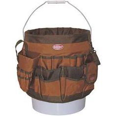 a brown bucket with two pockets on it