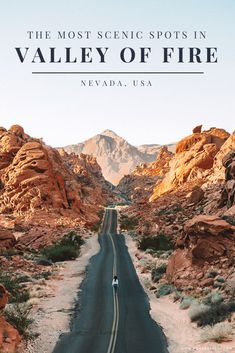 the valley of fire is shown with mountains in the background and a car driving down the road