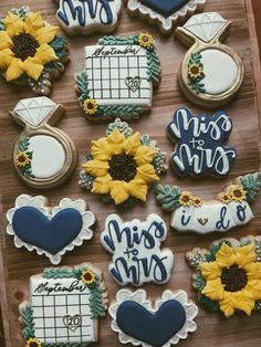 decorated cookies with sunflowers and other decorations on a wooden board that says, miss to mrs