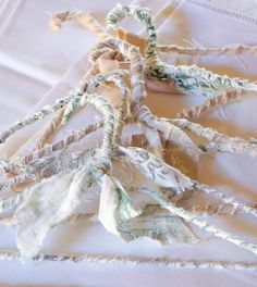 several pieces of fabric tied together on a bed