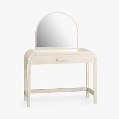 a white dressing table with a mirror on it