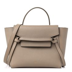 This is an authentic CELINE Grained Calfskin Mini Belt Bag in Light Taupe. This chic tote is crafted of richly textured calfskin leather with a structured and spacious silhouette in beige. The bag features a leather strap top handle, an optional shoulder strap, and a facing flap secured by a strap and brass magnet. This opens to a beige suede leather interior. Luxury White Baguette Bag With Main Compartment, Formal Beige Epsom Leather Shoulder Bag, Beige Epsom Leather Shoulder Bag With Detachable Strap, Beige Epsom Leather Bag With Gold-tone Hardware, Beige Epsom Leather Shoulder Bag For Travel, Beige Epsom Leather Travel Shoulder Bag, Travel Beige Epsom Leather Shoulder Bag, Beige Epsom Leather Bag With Detachable Strap, High-end Beige Calf Leather Bag