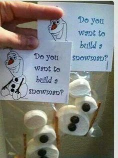 a hand holding up some marshmallows with the words do you want to build a snowman?