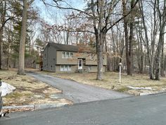 a house in the middle of a wooded area