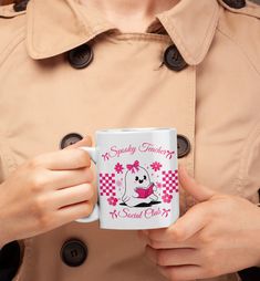 a woman in a trench coat holding a coffee mug with the words speedy teaching on it