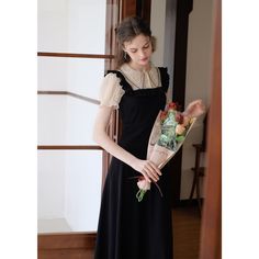 A docking dress that combines a blouse with embroidery on the collar and a jumper skirt with frills on the shoulder straps. Although it has a slender silhouette, it has a stretchy texture. The glossy black creates an elegant atmosphere. 
 
 Size 
 
 S size 
 
 Length: 116cm 
 Shoulder width: 33cm 
 Bust: 80-84cm 
 Waist: 62-70cm 
 Sleeve length: 22cm 
 
 M size 
 
 Length: 118cm 
 Shoulder width: 34cm 
 Bust: 84-88cm 
 Waist: 66-74cm 
 Sleeve length: 23cm 
 
 L size 
 
 Length: 120cm 
 Shoulder Elegant Fitted Suspender Dress With Lace Trim, Elegant Party Suspender Dress With Lace Trim, Elegant Black Vintage Dress For Summer, Elegant Black Vintage Summer Dress, Elegant Vintage Dress With Square Neck And Ruffles, Chic Black Dress With Lace Collar, Black Square Neck Dress With Ruffles, Black Vintage Dress For Summer Formal, Black Vintage Summer Dress For Formal Occasions