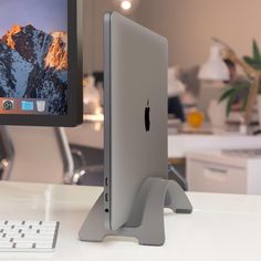 an apple computer sitting on top of a desk