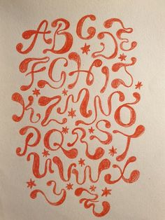 the letters are drawn in red ink on white paper