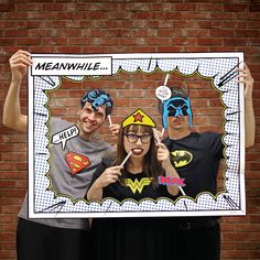 two people are posing for a photo in front of a brick wall with a sign that says meanwhle