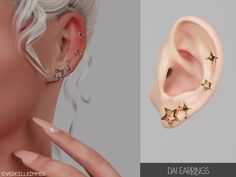 the earring is designed to look like stars and has two piercings on each side