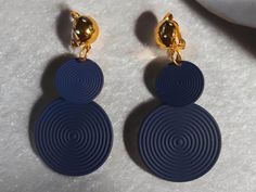 small and light style  Hammered blue disc These hang 2 inches gold  clip on closure Very lightweight  Pairs beautifully with other gold or blue accessories Blue Clip-on Drop Earrings, Blue Clip-on Earrings As Gift, Blue Disc, Blue Accessories, Light Style, Gold Clips, Hammered Metal, Earrings Blue, Fashion Lighting