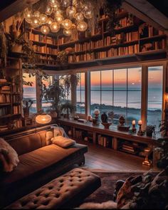 a living room filled with lots of furniture next to a large window covered in books