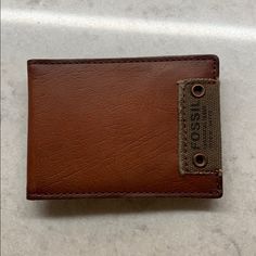 Fossil Brown Genuine Leather Slim Wallet Bi-Fold With Outer Money Clip 4” X 3” New, Never Used No Tags Or Fossil Tin Casual Brown Trifold Wallet With Interior Card Slots, Casual Bifold Leather Card Holder, Casual Brown Card Holder With Coin Pocket, Casual Brown Leather Card Holder, Casual Brown Bifold Card Holder, Casual Leather Card Holder, Casual Leather Trifold Wallet, Casual Brown Card Holder, Casual Rectangular Wallet With Snap Closure