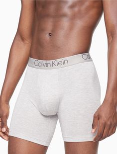 Eco-conscious with a luxurious feel, these Calvin Klein boxer briefs are crafted from sustainably sourced modal with added breathability and long lasting fibers. Designed with a super soft recycled logo waistband, a sleek contoured pouch and a turnback hem for a clean finish. Comes in a 3-pack.  Material: 90% Modal, 10% Elastane. Recycled Logo, Calvin Klein Boxer Briefs, Soft Modern, Belted Blazer, Womens Wellness, Signature Collection, Women's Fitness, Swimsuit Tops, Boxer Briefs