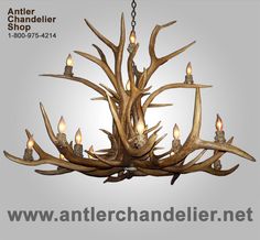 an antler chandelier with candles in it