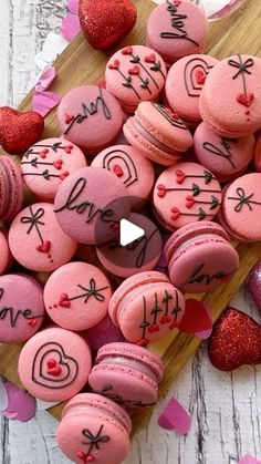 valentine's day macaroons on a cutting board with hearts and confetti